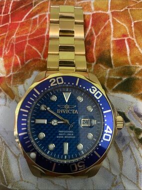 Invicta Gold Tone Watch with Blue Dial and Bezel